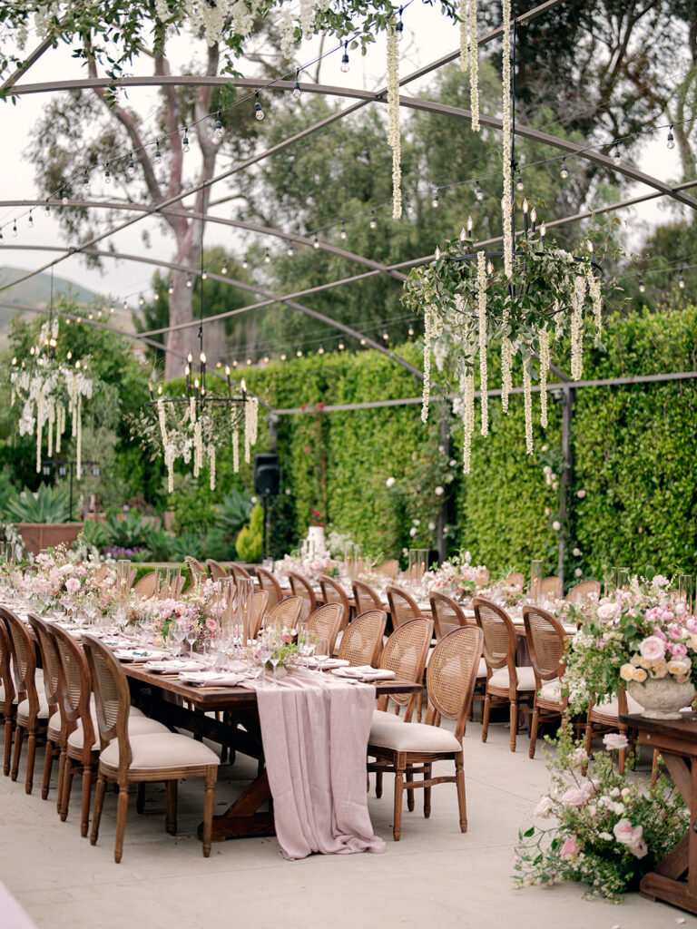 outdoor reception tables set up on the patio of a Malibu mansion wedding venue