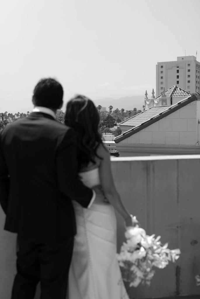 Bride and groom overlooking the city during a luxury outdoor wedding, reflecting a refined wedding design shaped by a thoughtful wedding design process.