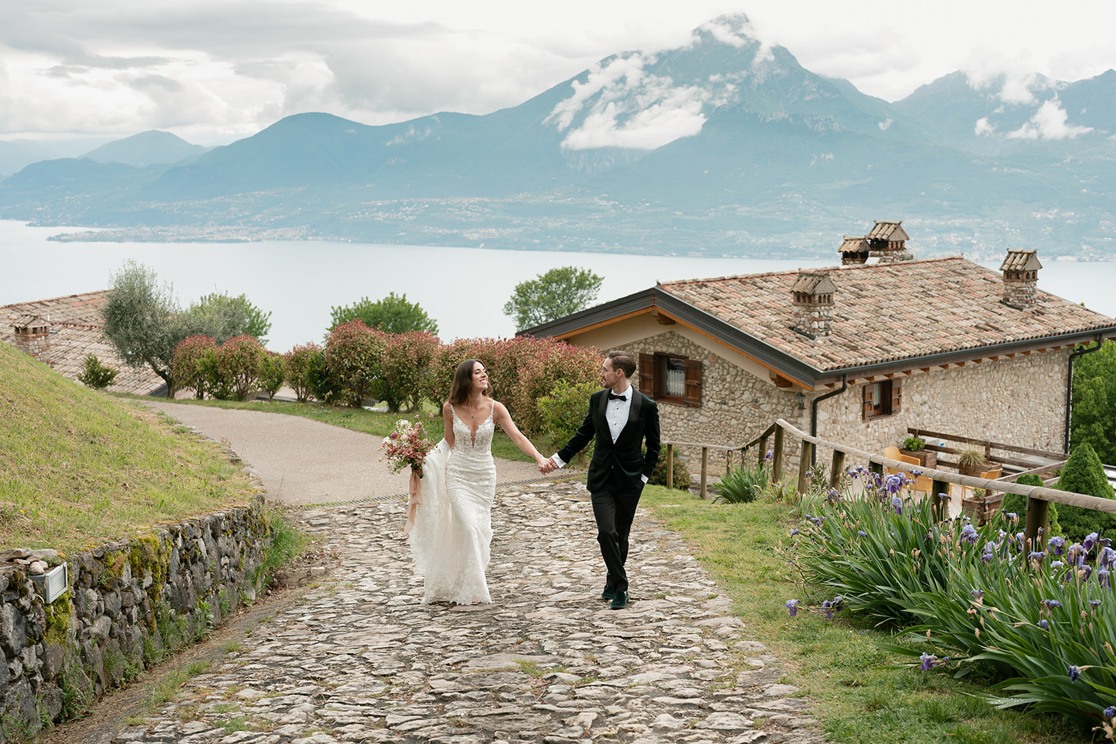Bride and groom walking together through a scenic destination setting, reflecting an intentional wedding experience designed around meaningful moments for guests.