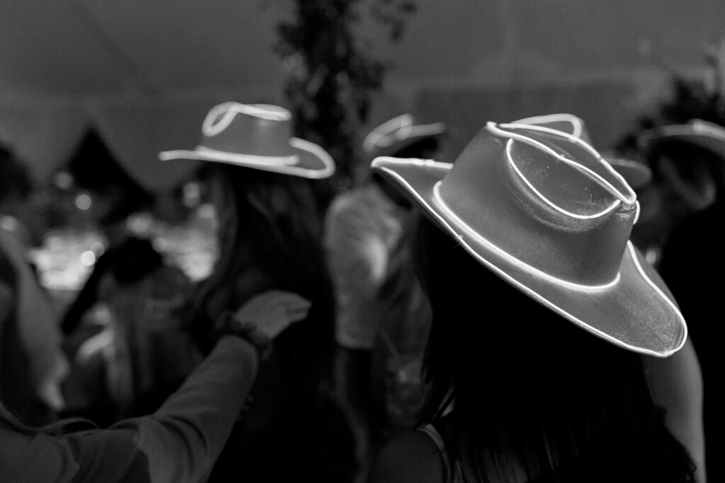 Candid guest moment on the dance floor capturing the energy and atmosphere of an evening wedding celebration
